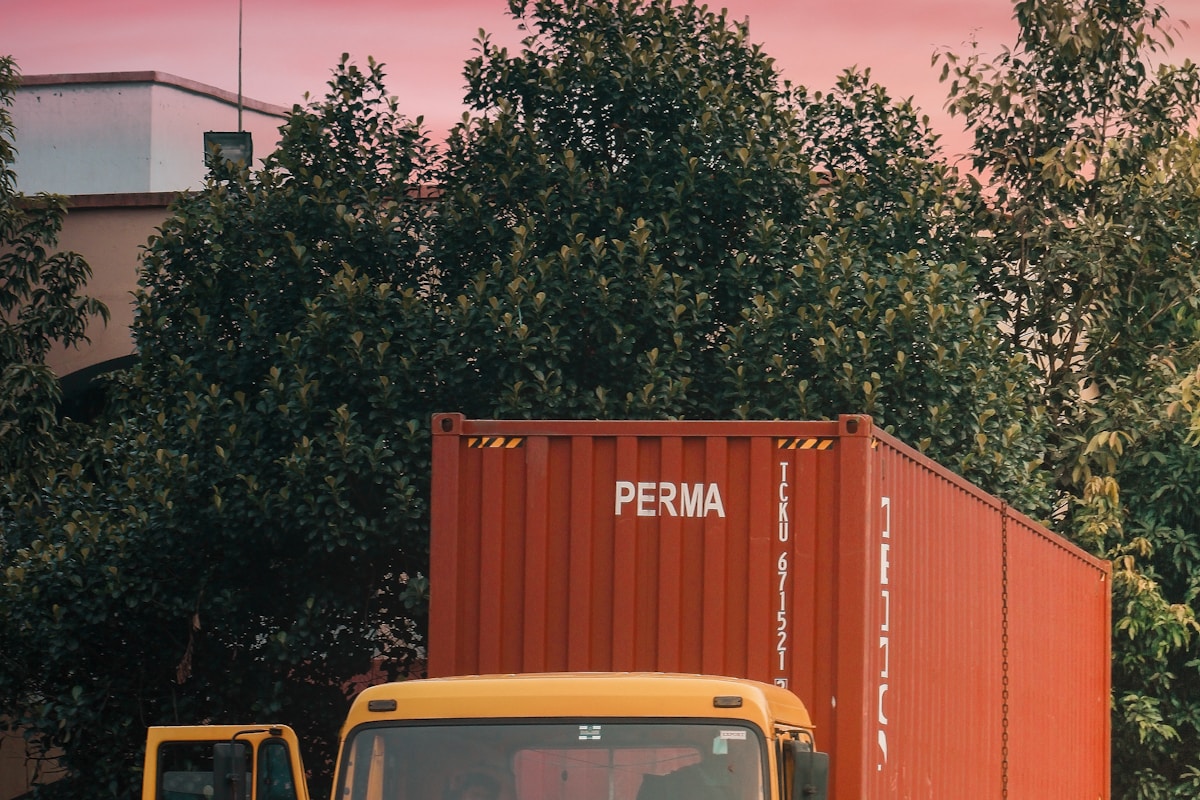 Logistics team monitoring live shipment tracking on screens